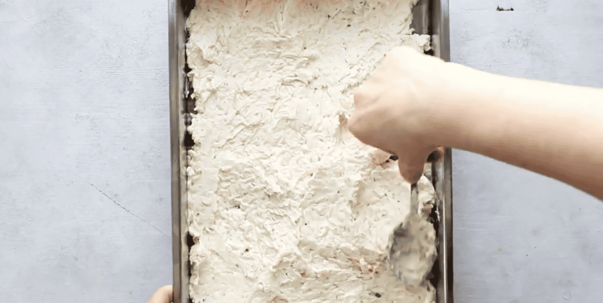 spreading the cheese mixture into a baking pan
