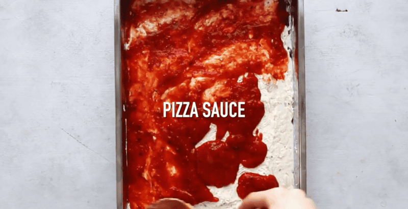 pizza sauce on top of cheese mixture