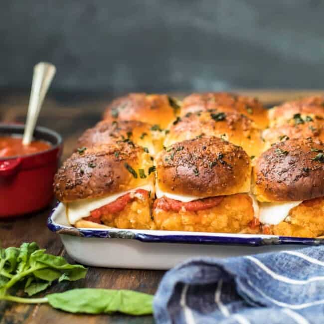a baking dish with Chicken Parmesan Sliders on it.