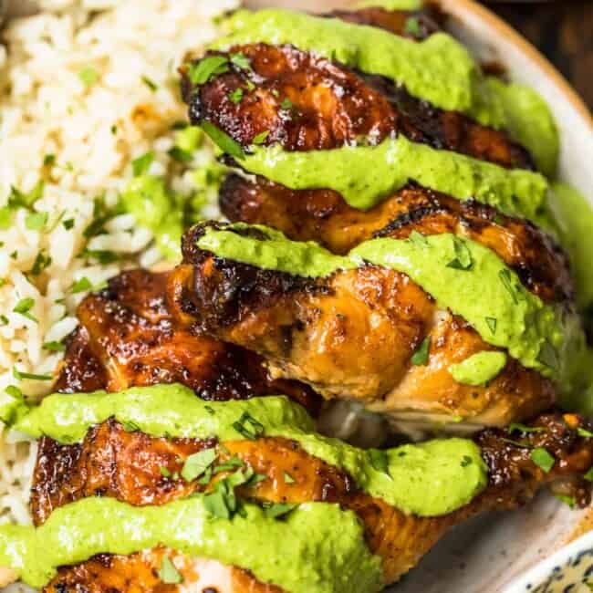 peruvian chicken with green sauce on plate