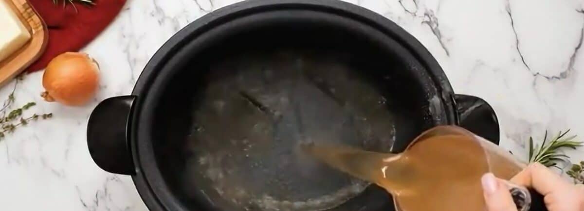 Heating the broth in the crockpot.