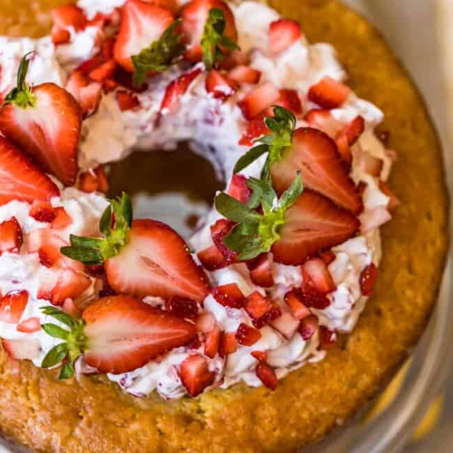 butter cake and strawberries and cream on a cake plate