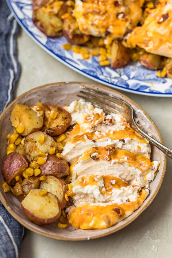 Bacon Crusted Chicken sliced in a bowl and served with the ranch potatoes