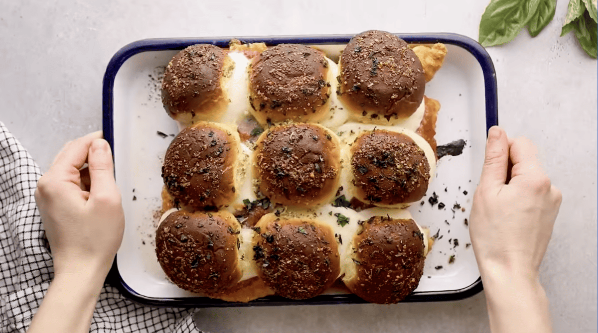 baked chicken parmesan sliders on a baking sheet.