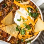 over the top view of easy taco soup in a bowl with chips