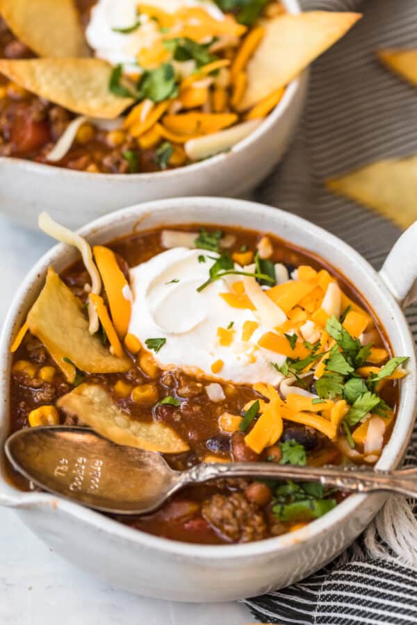 A spoon in a bowl of soup