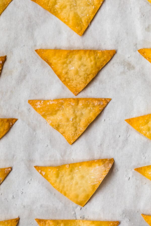 Close up of baked wonton chips on a baking sheet