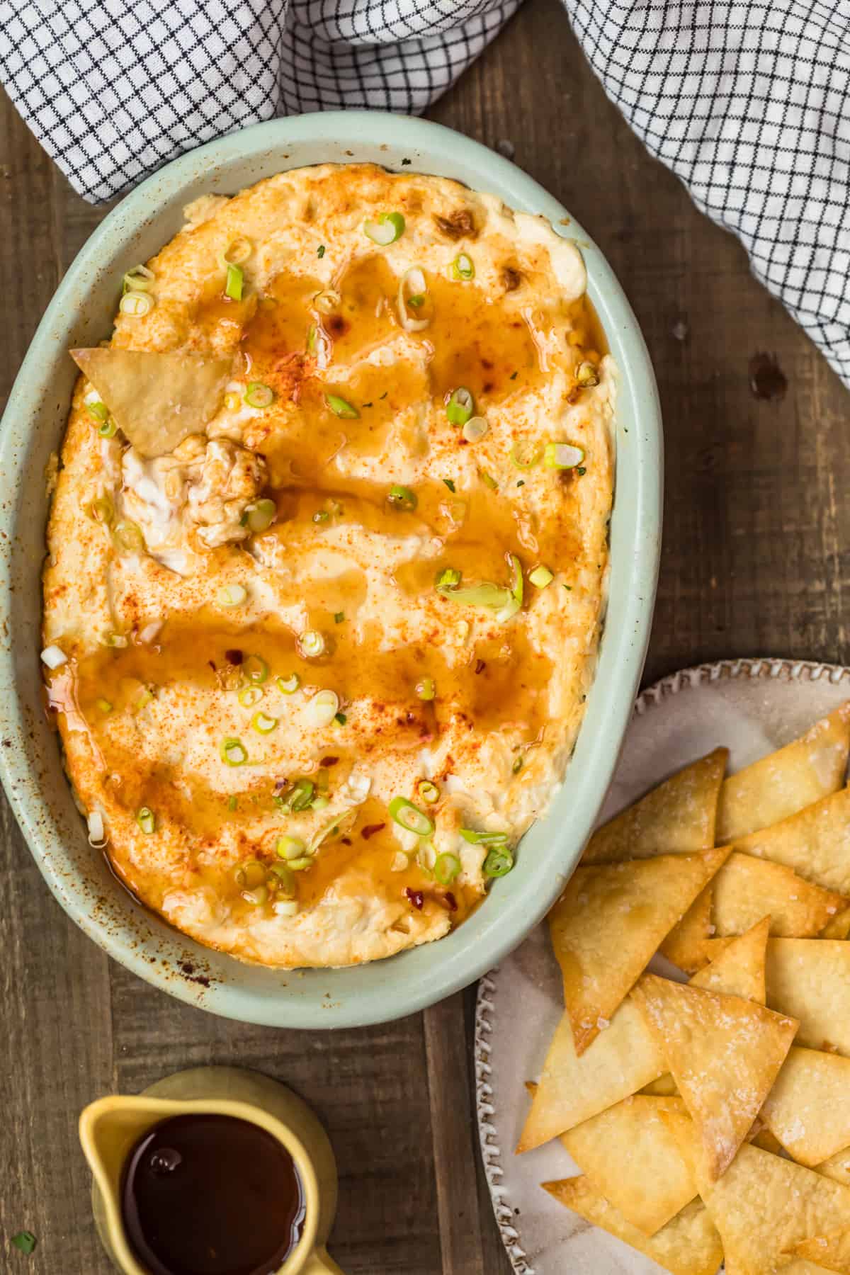 Crab rangoon dip next to a bowl of chips