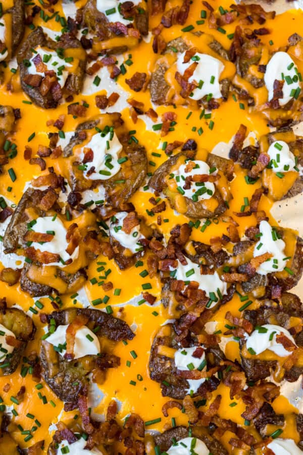 Loaded Smashed Potatoes topped with bacon and cheese