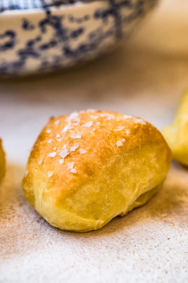 A dinner roll topped with salt