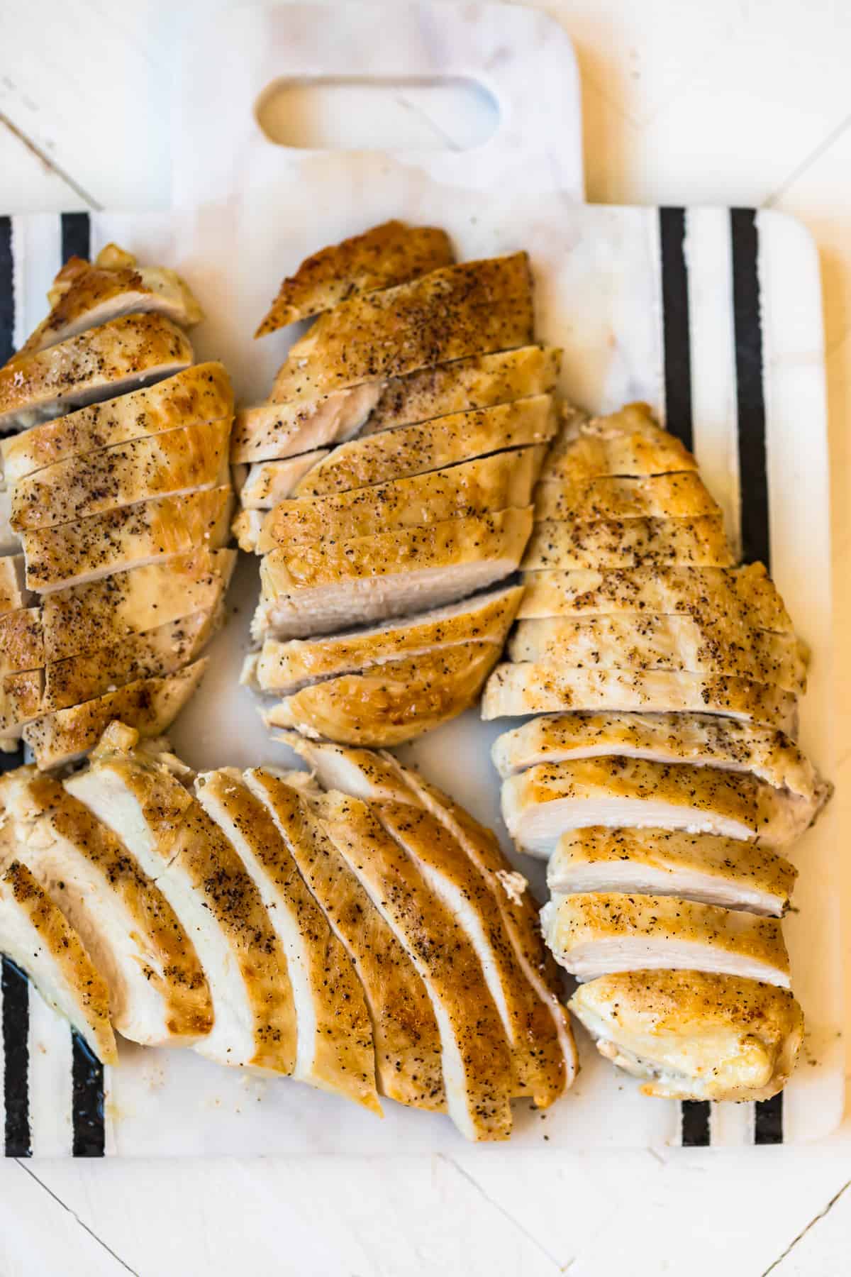Sliced Pan seared chicken breasts on a plate