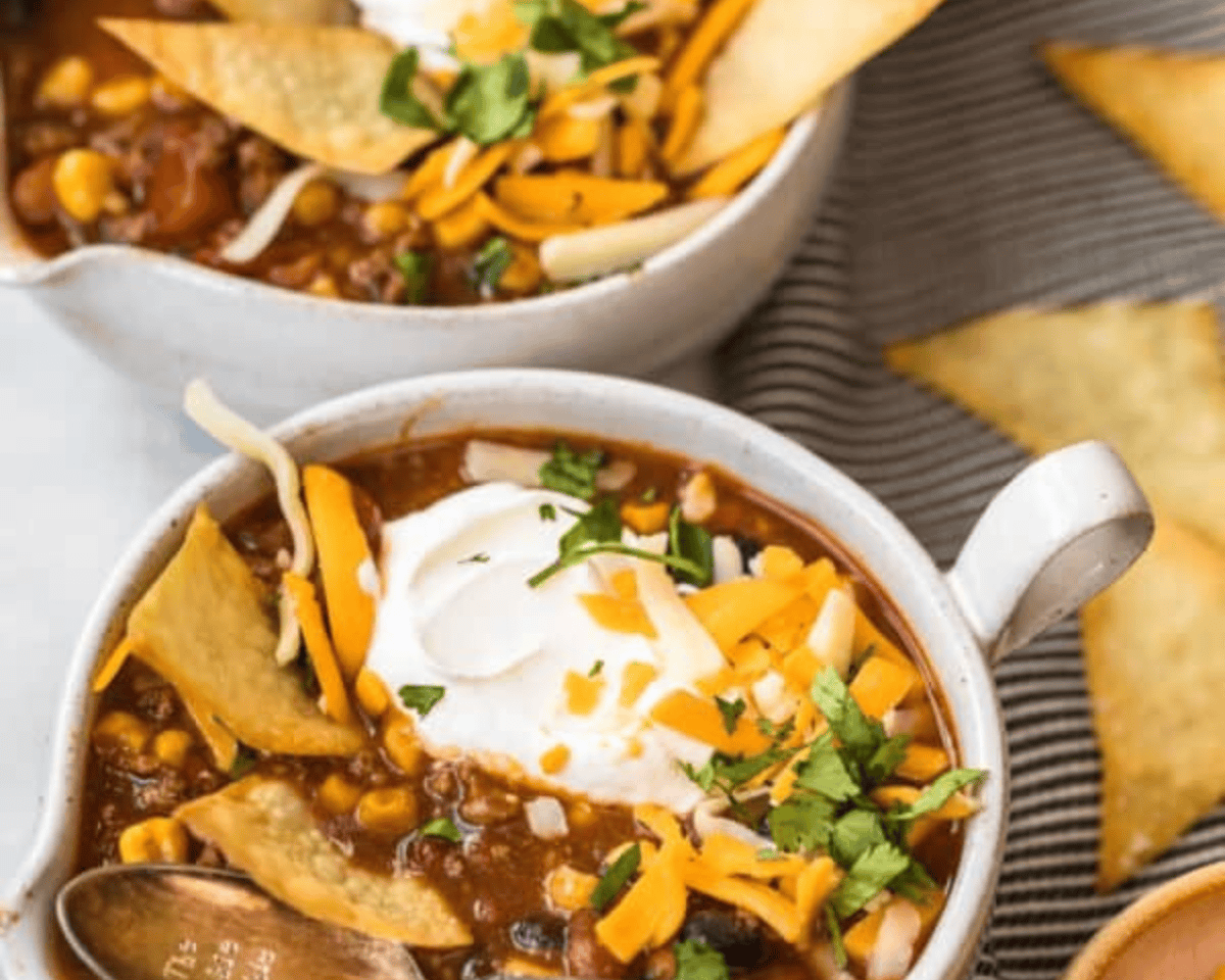 Taco soup in a white bowl.