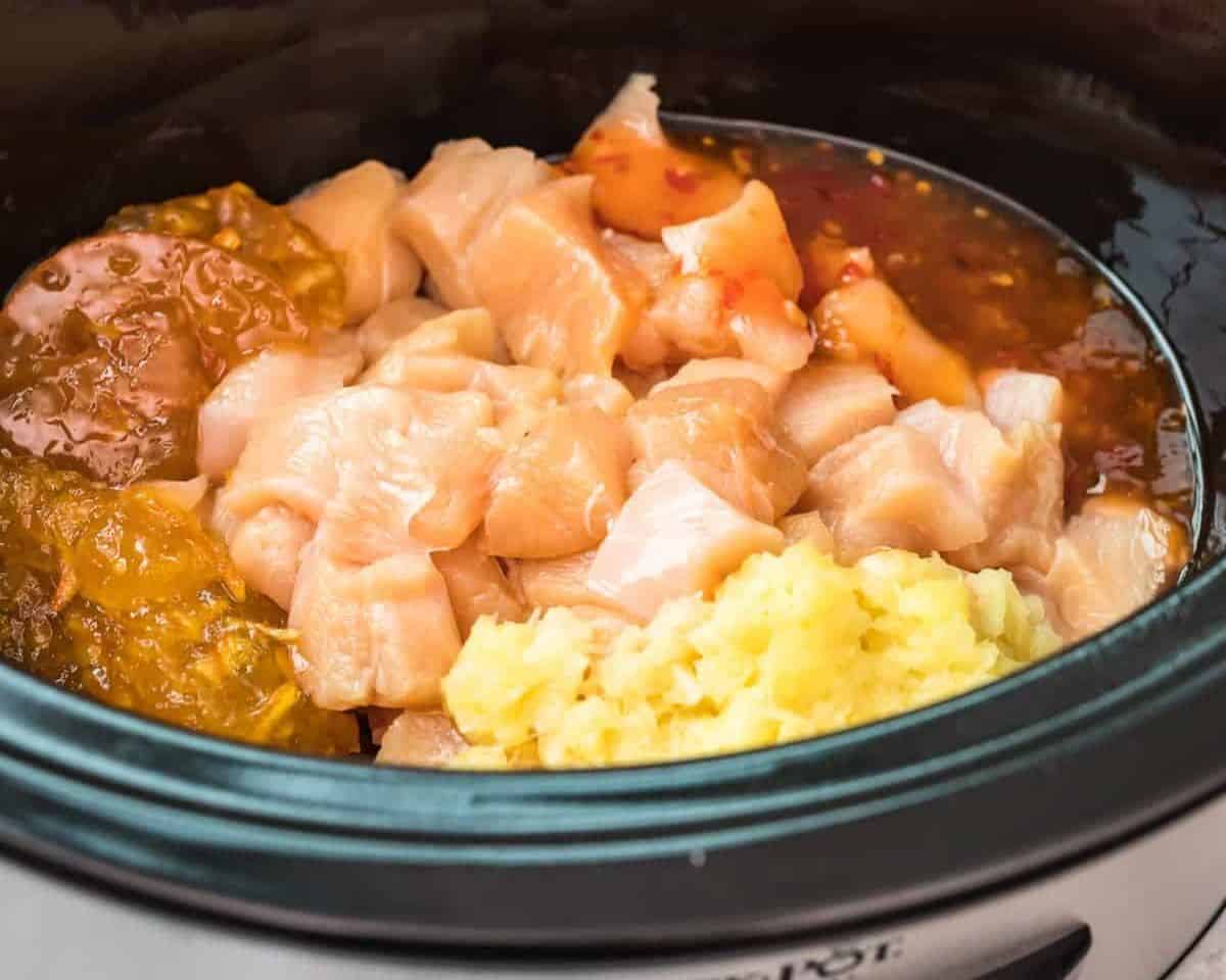 Ingredients to make crockpot sweet and sour chicken in the crockpot. 