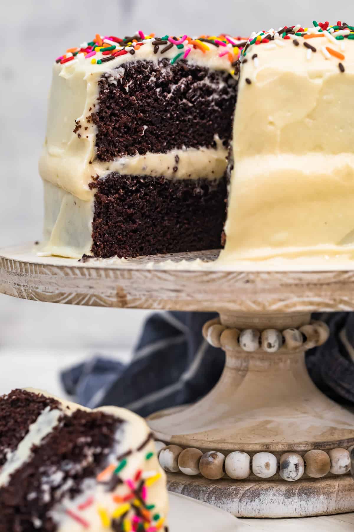 chocolate cake with best white icing on cake stand