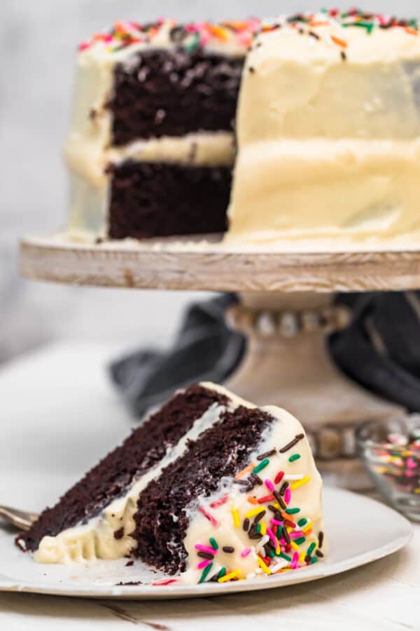 chocolate cake with best white icing on cake stand