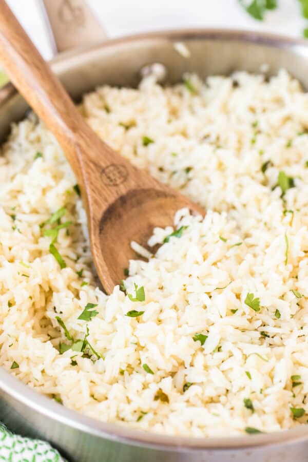 spoon in cilantro lime rice in skillet