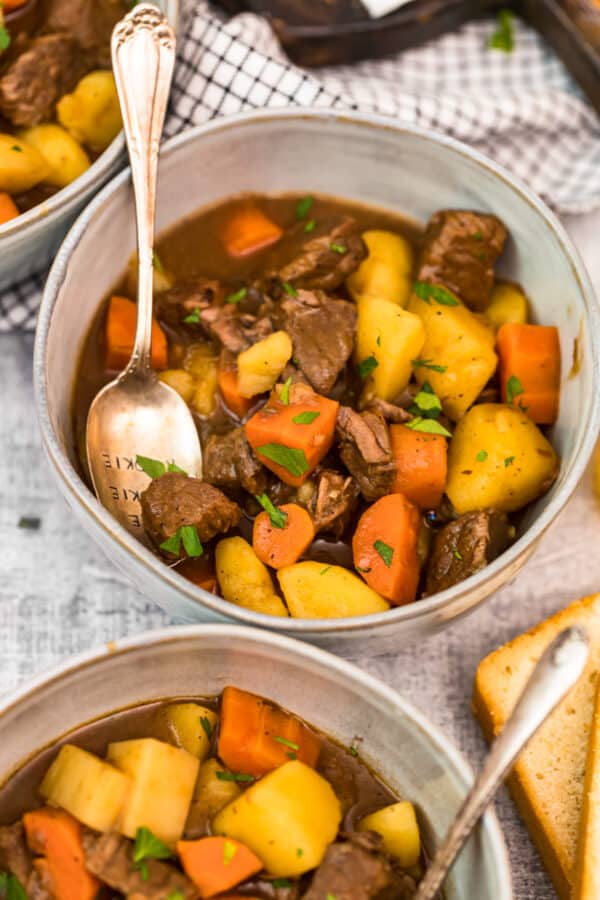 up close bowl of beef stew with spoon