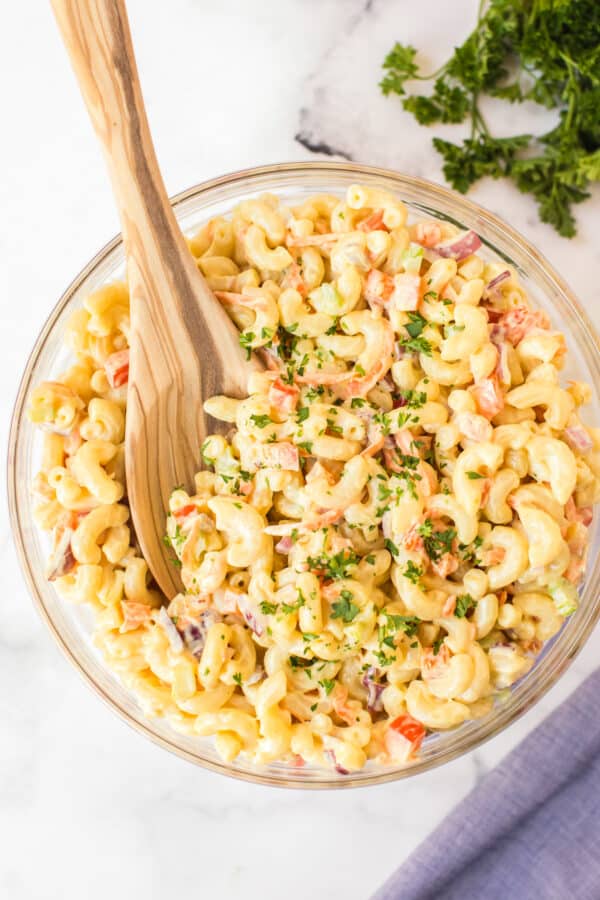 overhead image of macaroni salad with wooden spoon