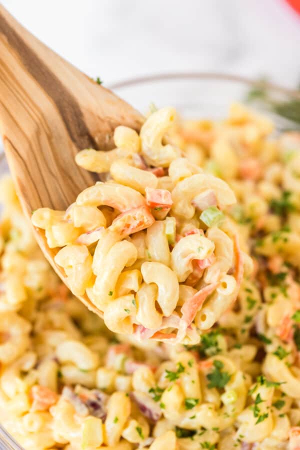 spoon lifting up pasta salad