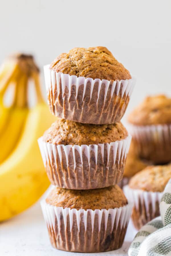 three banana muffins stacked