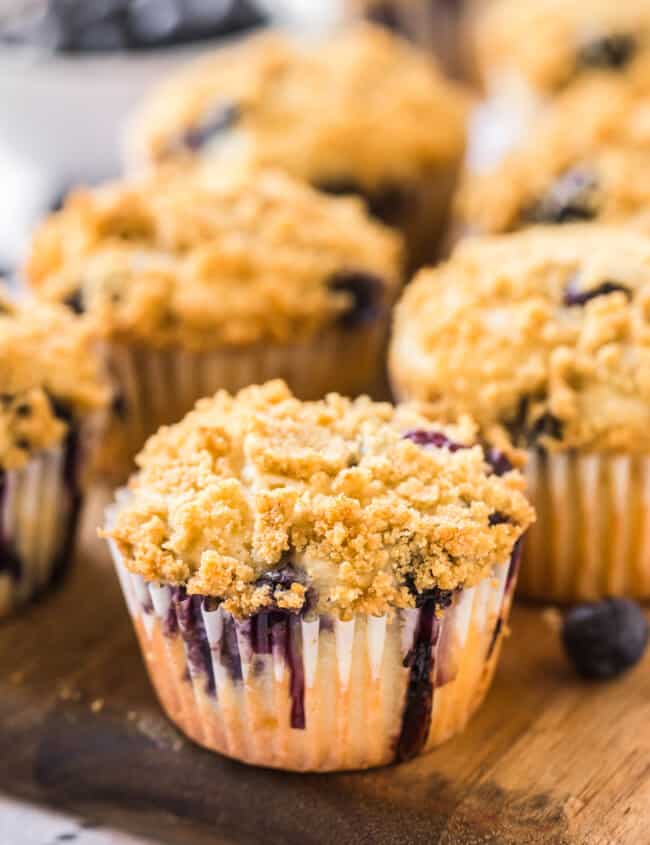 blueberry muffins on cutting board