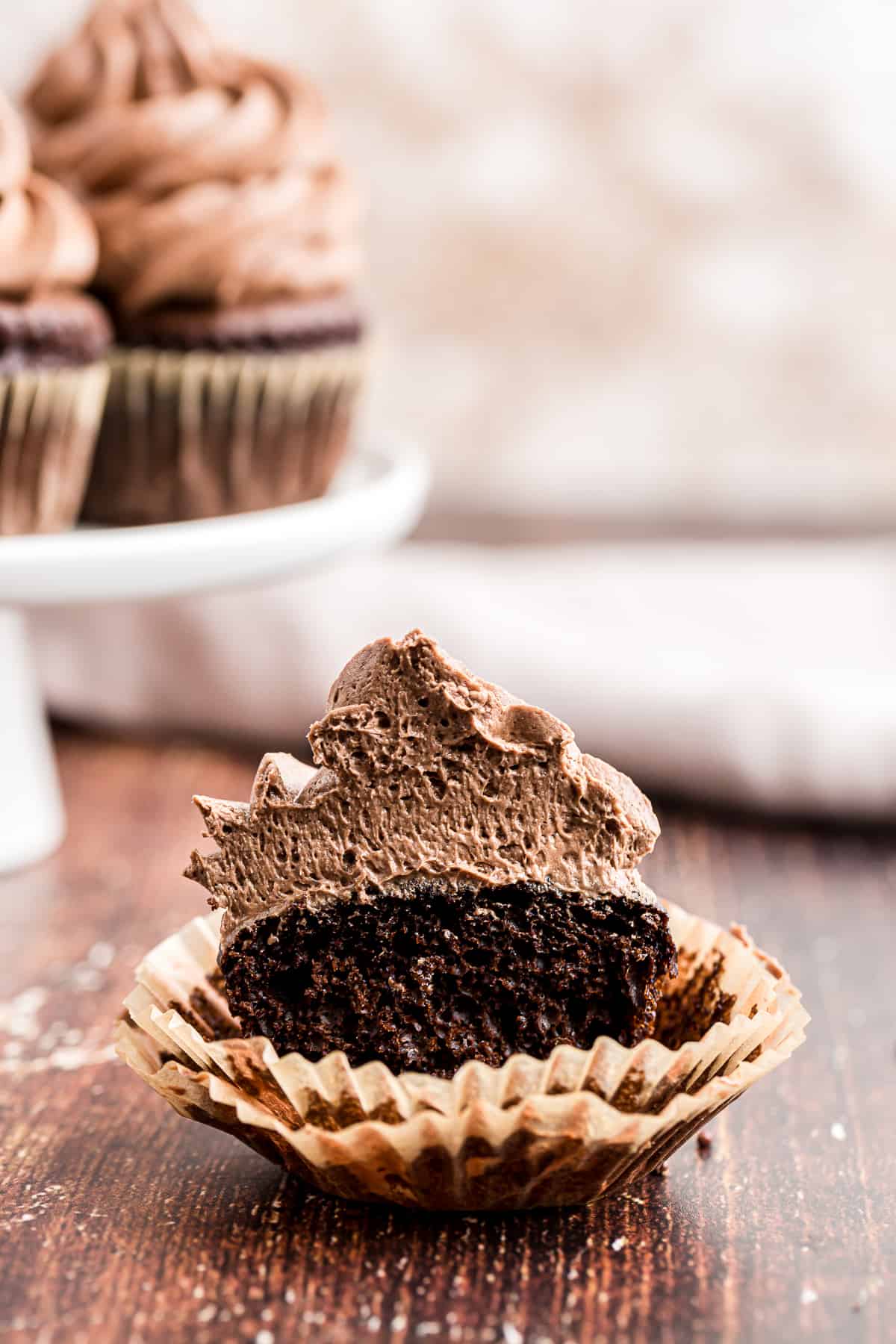 chocolate cupcake cut in half showing buttercream icing texture
