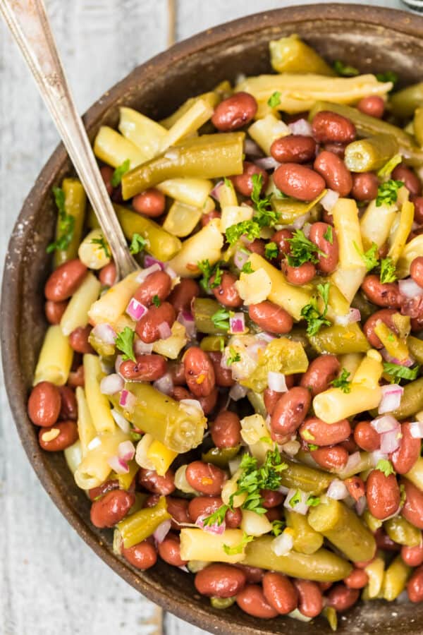 three bean salad in bowl with spoon