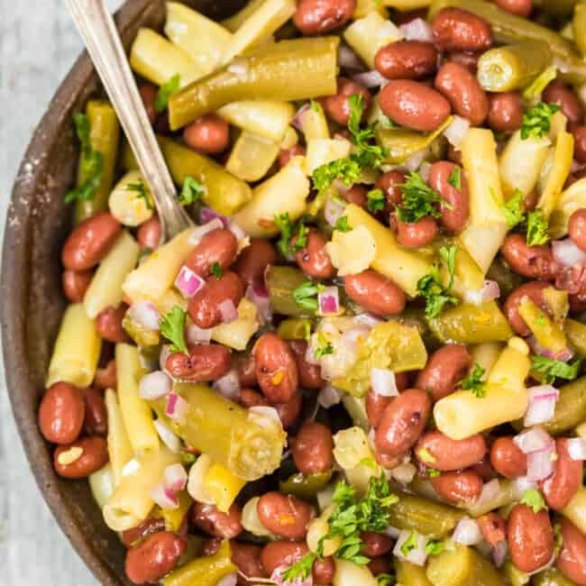 three bean salad in bowl with spoon