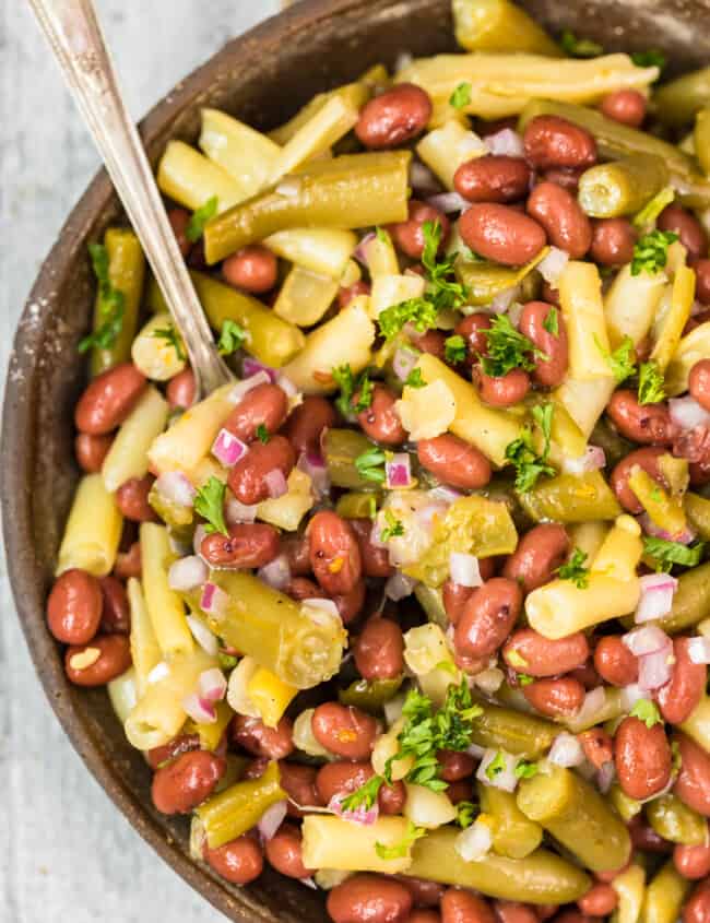 three bean salad in bowl with spoon