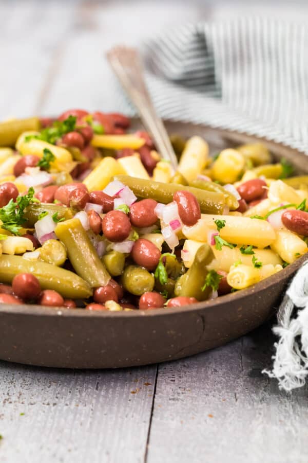 side image of bowl filled with 3 bean salad