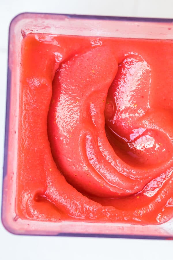 up close image of frozen strawberry margaritas in pitcher