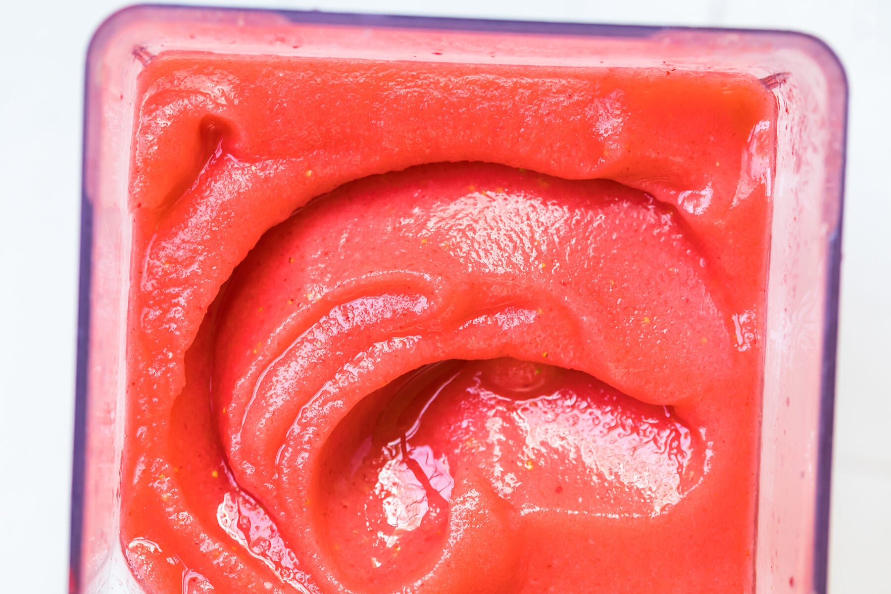 up close image of frozen strawberry margaritas in pitcher