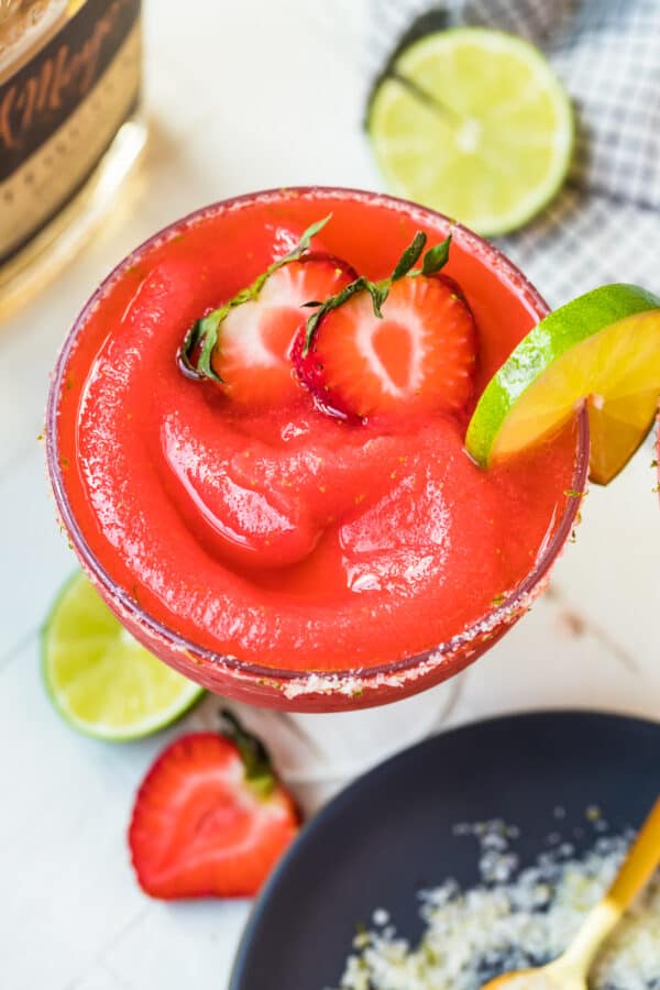 overhead image of frozen strawberry margarita in glass