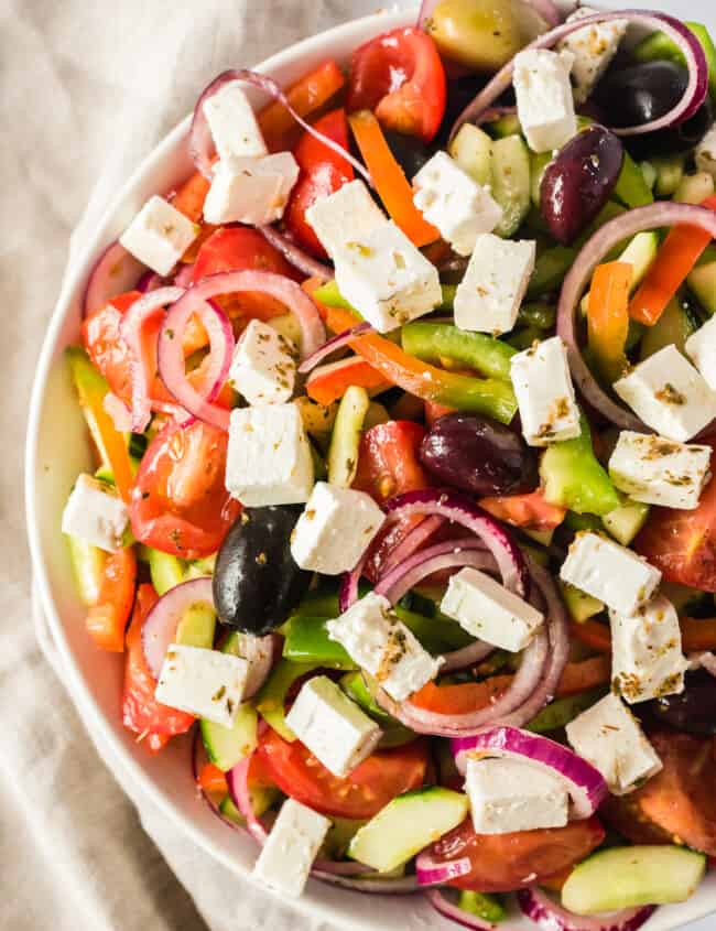 up close image of greek salad in bowl