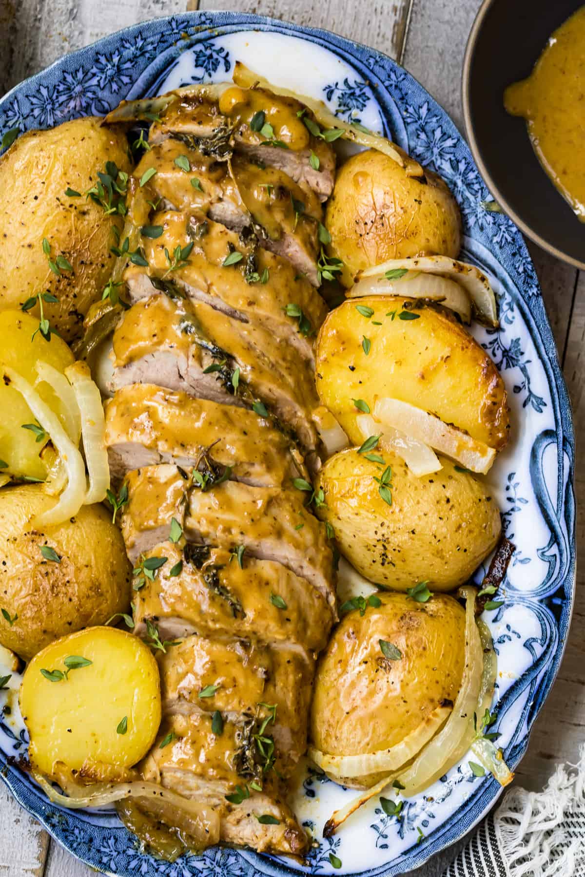 overhead image of honey mustard pork tenderloin with potatoes on platter