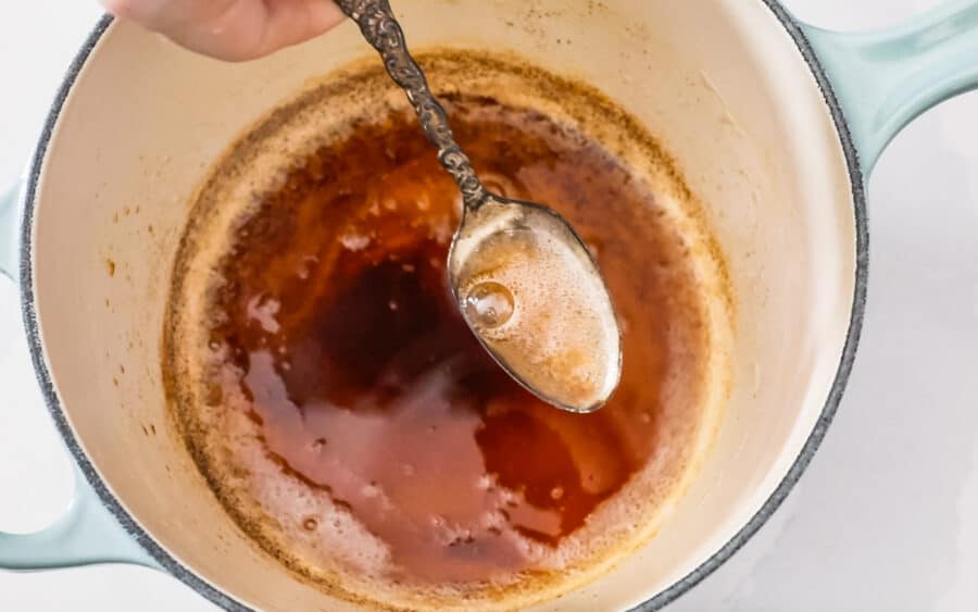 spoon lifting browned butter from pan