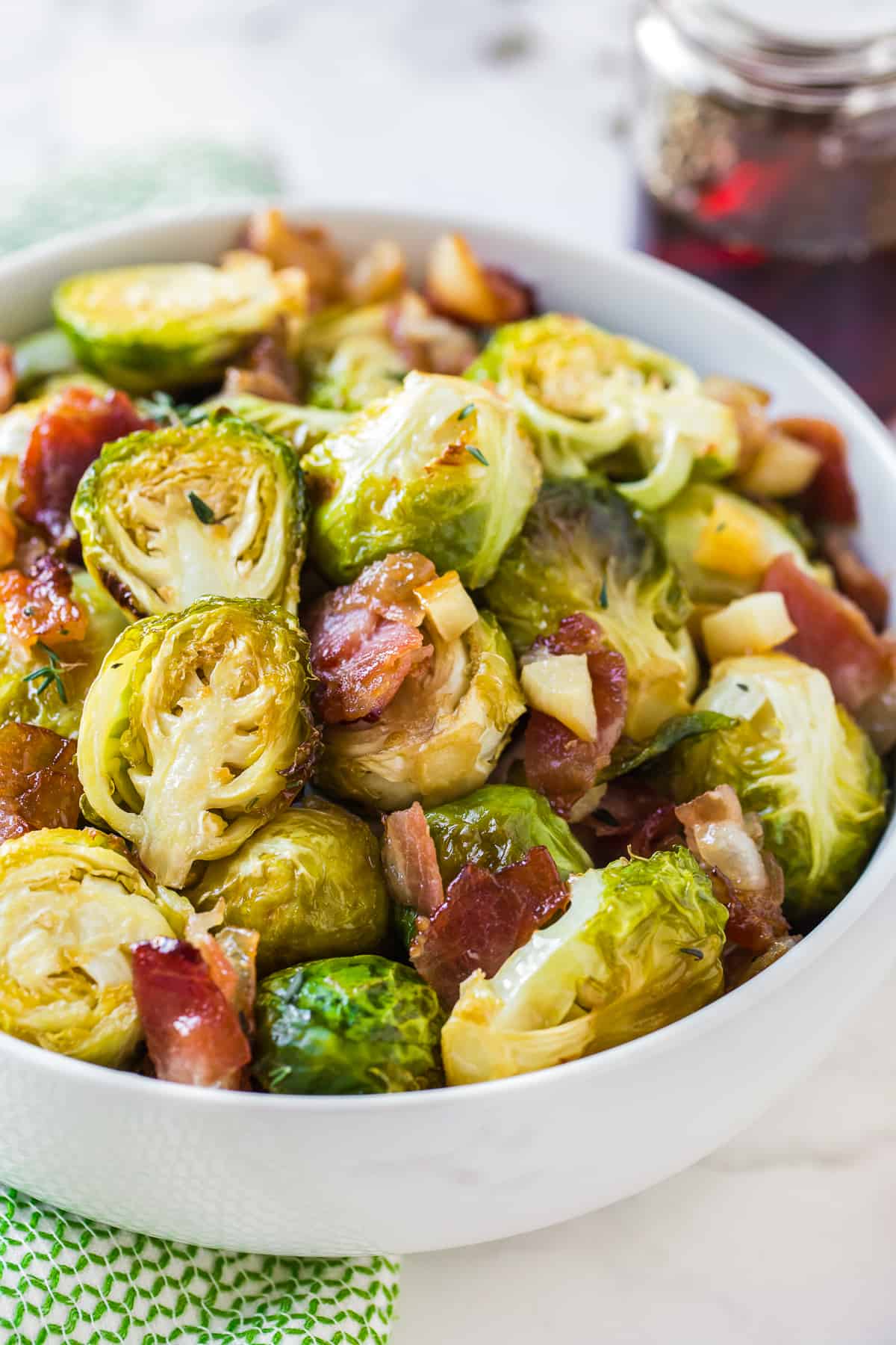 maple bacon brussels sprouts in white bowl