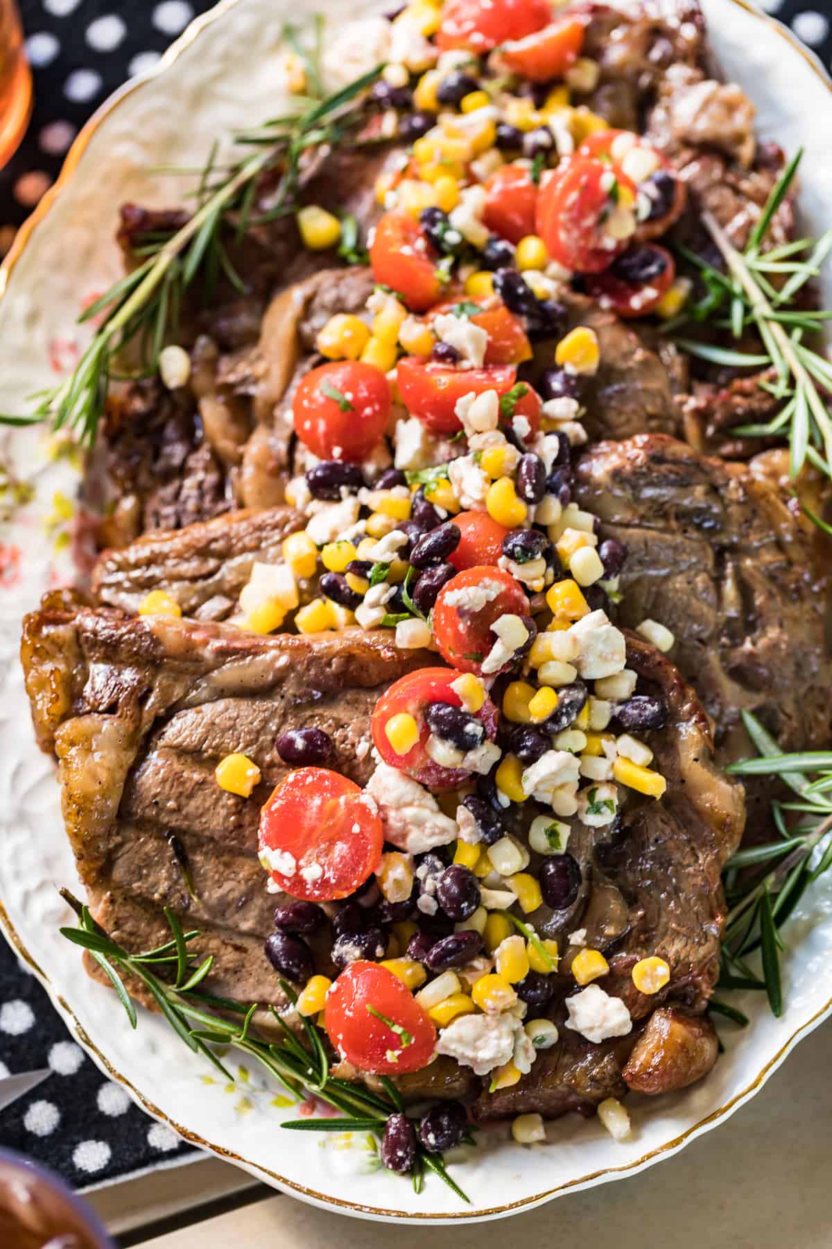 sweet tea marinated steaks topped with corn salad