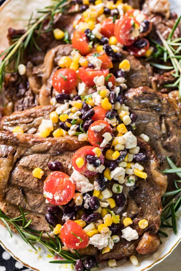 sweet tea marinated steaks topped with corn salad