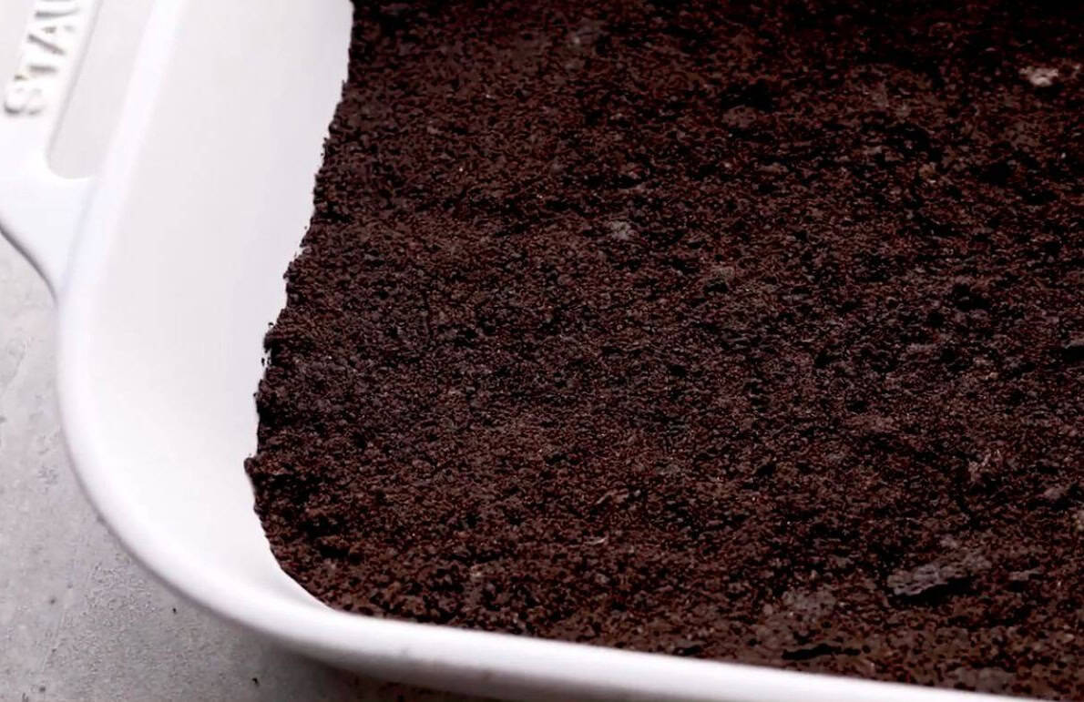 spread the oreo mixture into the bottom of a 9×13-inch pan