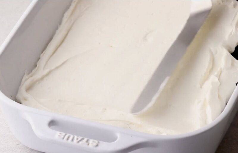 spread cream cheese layer over the oreo crust