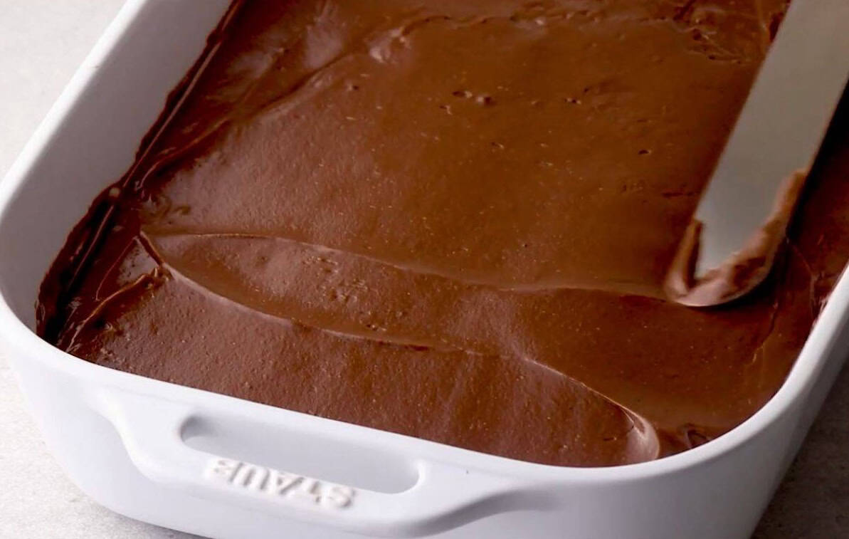 pour chocolate pudding over cream cheese layer
