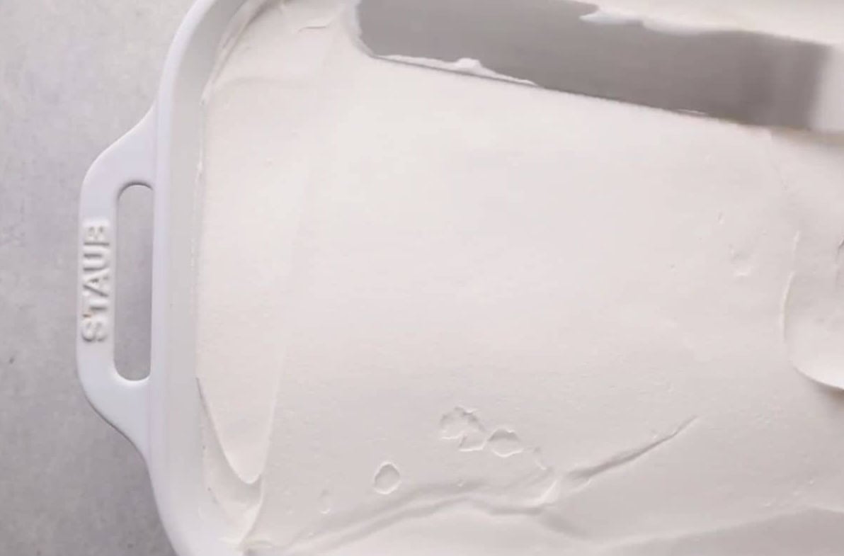 second layer oh whipped topping over chocolate pudding layer