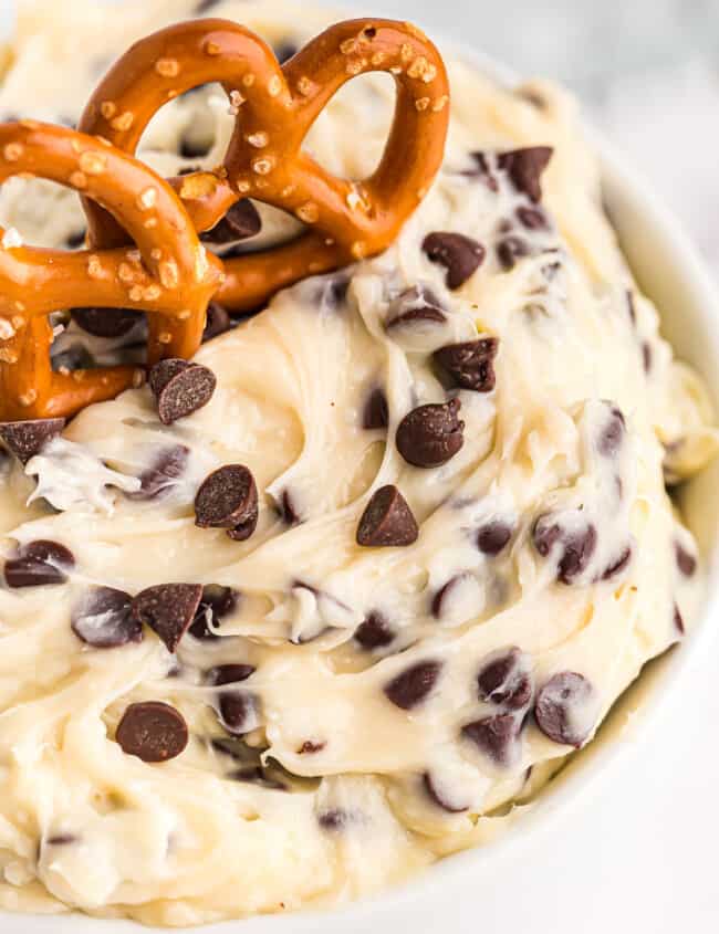 up close image of chocolate chip cookie dough dip with pretzels
