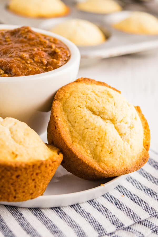 cornbread muffins next to bowl of chili