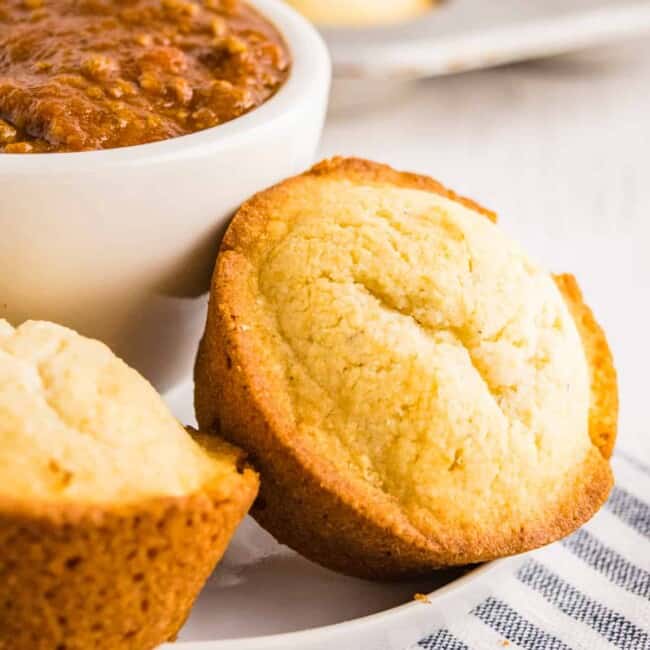 cornbread muffins next to bowl of chili