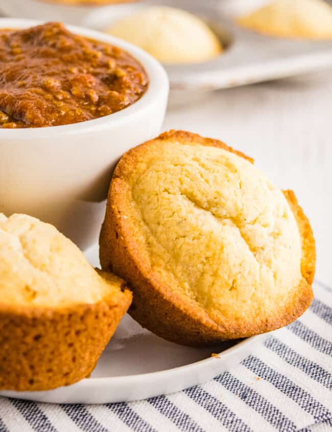 cornbread muffins next to bowl of chili