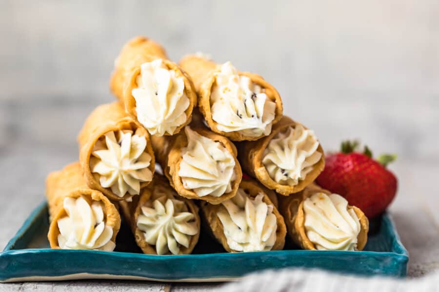 stacked cannolis on plate