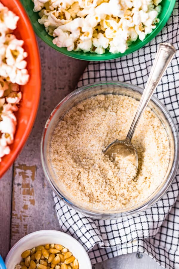 homemade kettle corn seasoning in clear bowl with spoon