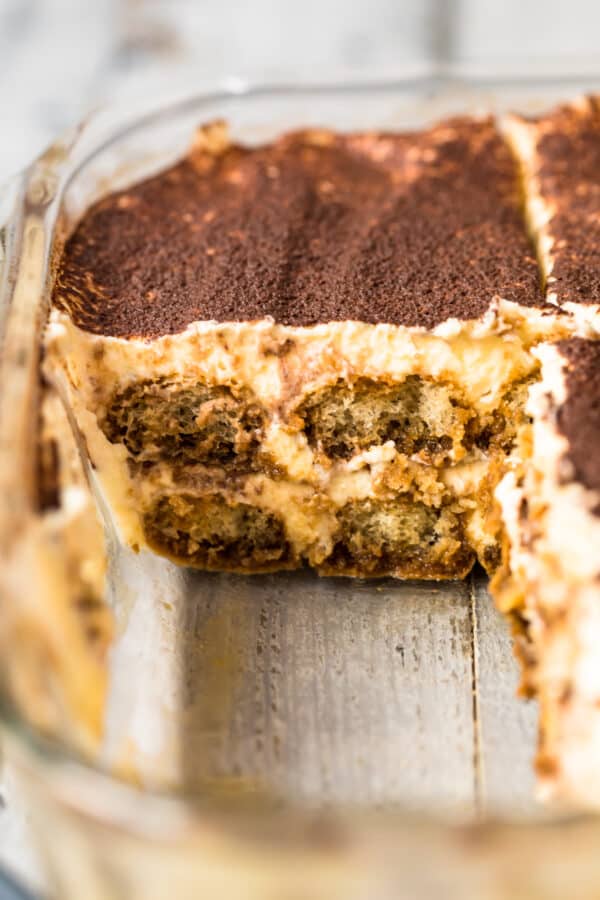 tiramisu in dish with slices cut out